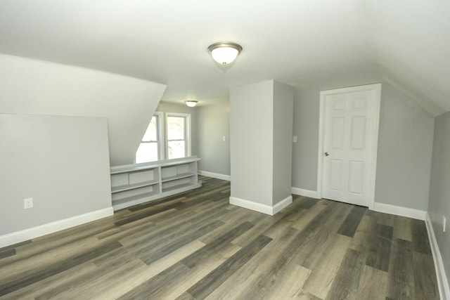 27 Church St, Livermore Falls, ME 04254 - additional living space with lofted ceiling, baseboards, and wood finished floors