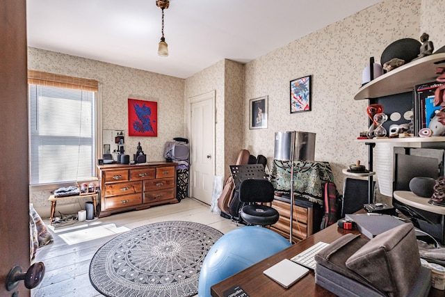 home office with wallpapered walls