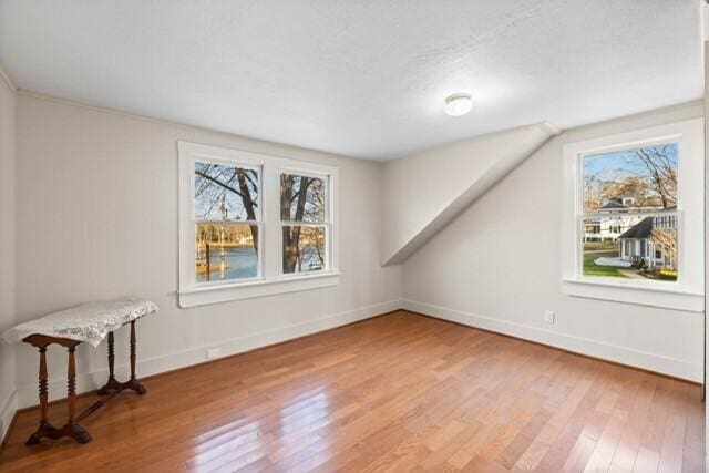 5 Paddy Creek Rd Unit 5, Kennebunkport, ME 04046 - additional living space with healthy amount of natural light and light wood finished floors