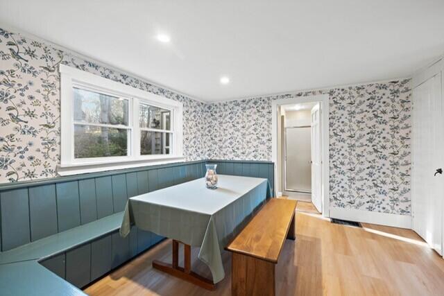 5 Paddy Creek Rd Unit 5, Kennebunkport, ME 04046 - dining space with wallpapered walls, wood finished floors, wainscoting, recessed lighting, and breakfast area