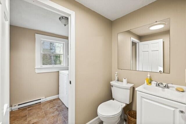 5 Paddy Creek Rd Unit 5, Kennebunkport, ME 04046 - half bathroom featuring baseboard heating and vanity