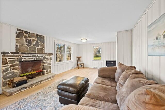 5 Paddy Creek Rd Unit 5, Kennebunkport, ME 04046 - living room with wood finished floors and a stone fireplace
