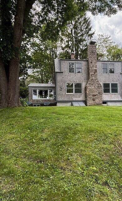 5 Paddy Creek Rd Unit 5, Kennebunkport, ME 04046 - back of property with a chimney and a lawn