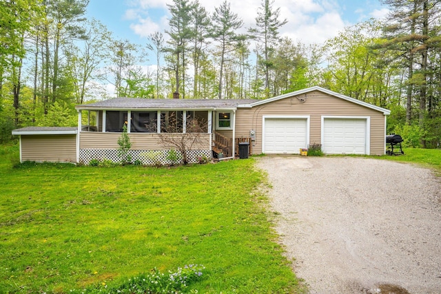 395 Hatch Rd, Auburn, ME 04210 - view of front of property featuring driveway, a front yard, an attached garage, and a sunroom