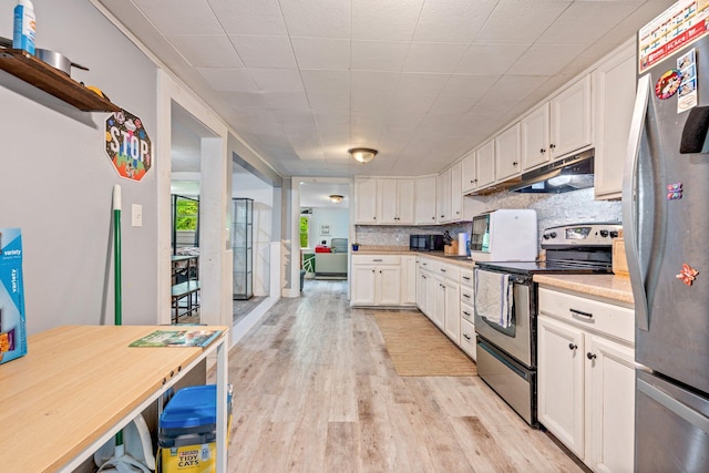 395 Hatch Rd, Auburn, ME 04210 - kitchen with stainless steel appliances, under cabinet range hood, light wood-type flooring, and white cabinets