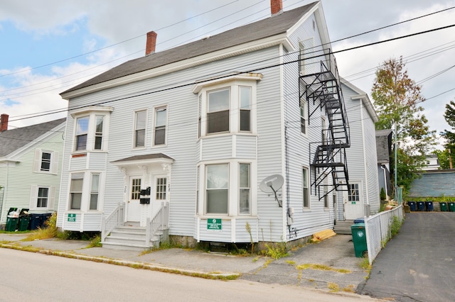 28 Cutts St, Biddeford, ME 04005 - townhome / multi-family property featuring entry steps and a chimney