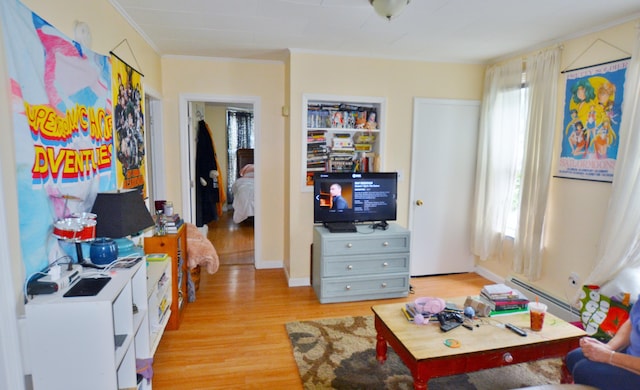 28 Cutts St, Biddeford, ME 04005 - living room with light wood-style floors, crown molding, a baseboard heating unit, and plenty of natural light