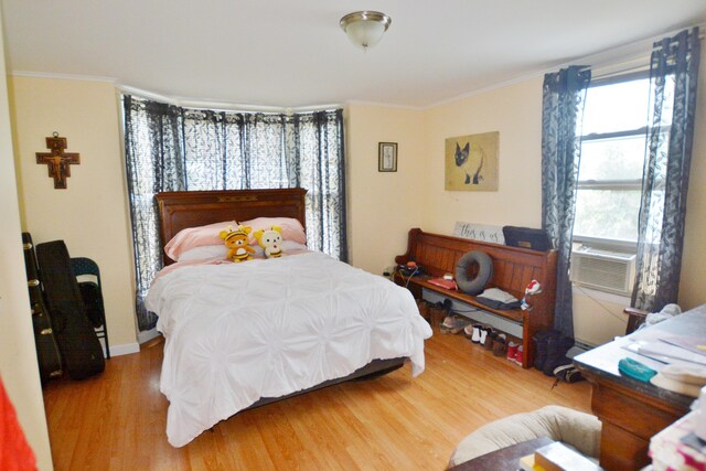 28 Cutts St, Biddeford, ME 04005 - bedroom featuring wood finished floors, ornamental molding, and cooling unit