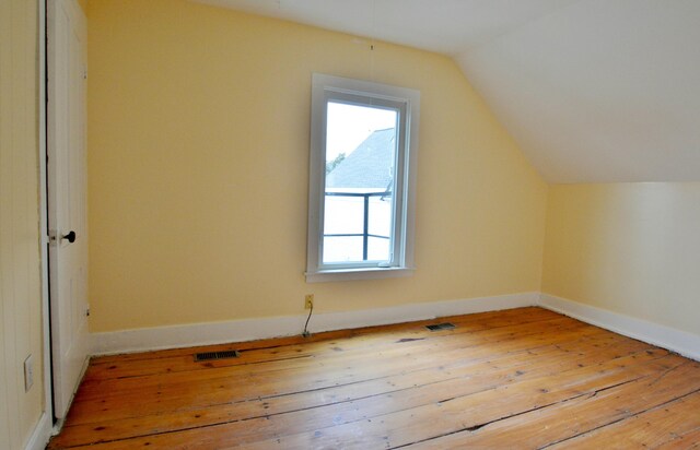 28 Cutts St, Biddeford, ME 04005 - additional living space with hardwood / wood-style floors and vaulted ceiling