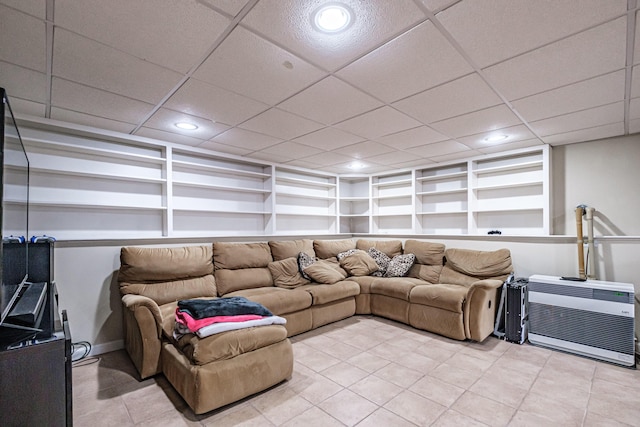 living area with baseboards, light tile patterned flooring, recessed lighting, and built in shelves