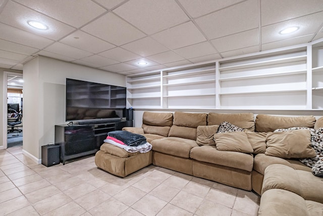 living area with baseboards, recessed lighting, built in features, and light tile patterned floors