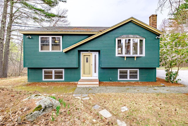 bi-level home with a chimney