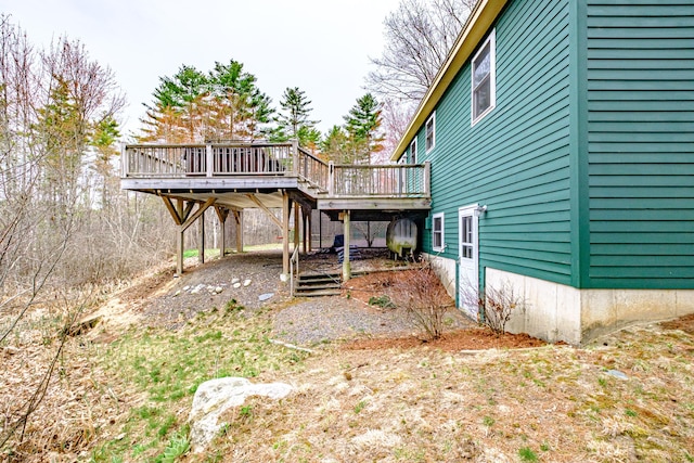view of yard featuring stairway and a deck