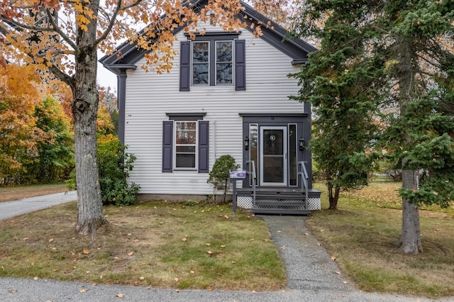 view of front of property with a front lawn