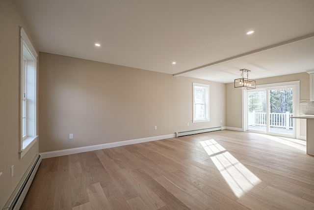 48 Highland Ave, Scarborough, ME 04074 - spare room with a baseboard heating unit and light wood-style floors