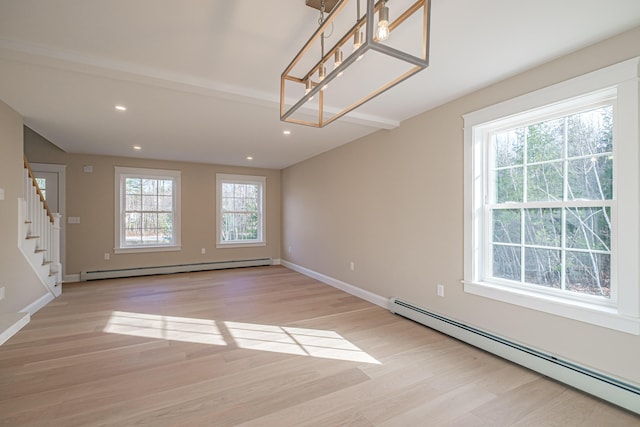48 Highland Ave, Scarborough, ME 04074 - spare room with a baseboard radiator, light wood-style floors, stairs, and recessed lighting