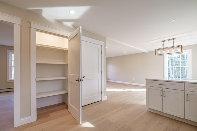 48 Highland Ave, Scarborough, ME 04074 - interior space featuring light wood-type flooring, baseboards, a baseboard radiator, and pendant lighting