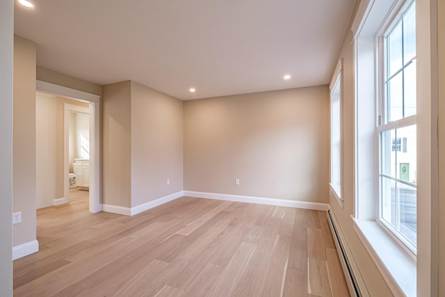 48 Highland Ave, Scarborough, ME 04074 - unfurnished room featuring light wood-type flooring, recessed lighting, a baseboard radiator, and a healthy amount of sunlight