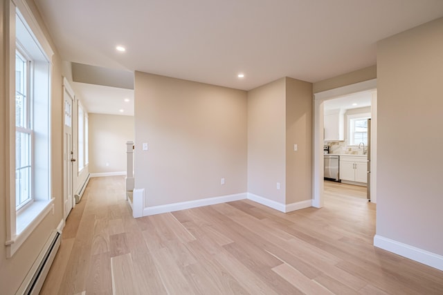 48 Highland Ave, Scarborough, ME 04074 - spare room featuring baseboards, recessed lighting, light wood-style floors, baseboard heating, and a baseboard radiator