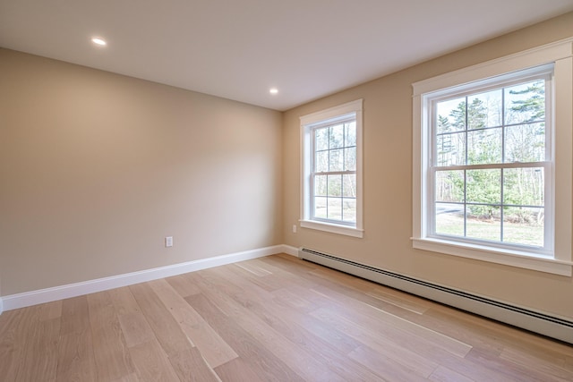 48 Highland Ave, Scarborough, ME 04074 - empty room featuring baseboard heating, baseboards, recessed lighting, and light wood-style floors