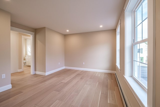 48 Highland Ave, Scarborough, ME 04074 - unfurnished room with baseboard heating, baseboards, light wood finished floors, and recessed lighting