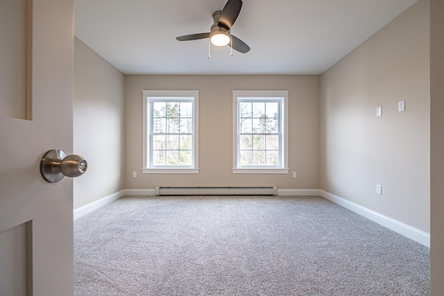 48 Highland Ave, Scarborough, ME 04074 - spare room with a baseboard heating unit, carpet flooring, baseboards, and a ceiling fan