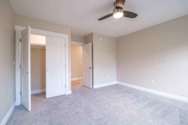 48 Highland Ave, Scarborough, ME 04074 - unfurnished bedroom featuring light carpet, baseboards, and ceiling fan