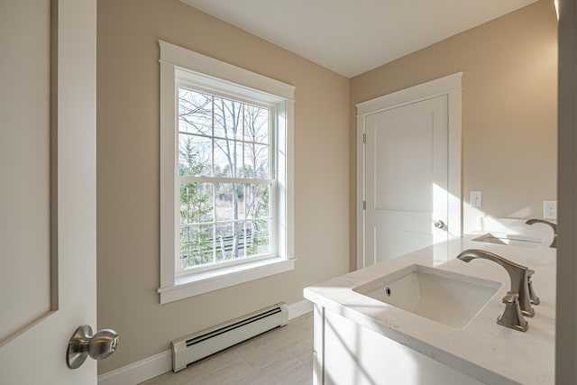48 Highland Ave, Scarborough, ME 04074 - bathroom featuring baseboards, vanity, and baseboard heating