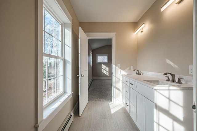 48 Highland Ave, Scarborough, ME 04074 - bathroom featuring double vanity, baseboards, and a sink