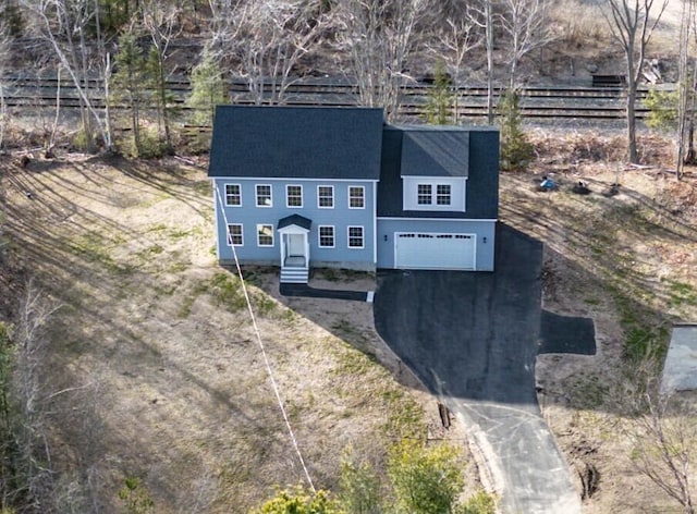 48 Highland Ave, Scarborough, ME 04074 - view of front of home featuring an attached garage, driveway, fence, and roof with shingles