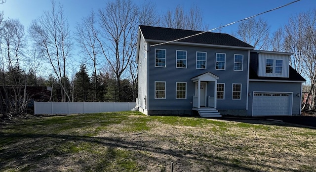 48 Highland Ave, Scarborough, ME 04074 - colonial home with fence, aphalt driveway, a front yard, and a garage