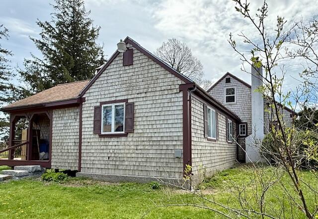 1361 Pleasant St, Blue Hill, ME 04614 - view of home's exterior featuring a yard