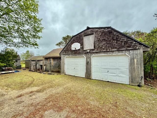 1361 Pleasant St, Blue Hill, ME 04614 - view of property exterior with a garage and an outdoor structure