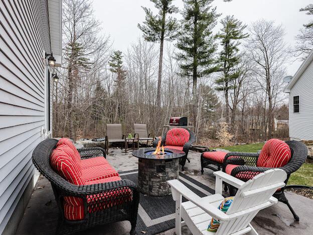 14 Connor Dr Unit 14, Gorham, ME 04038 - view of patio / terrace with an outdoor fire pit