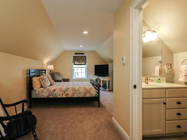 14 Connor Dr Unit 14, Gorham, ME 04038 - carpeted bedroom with a sink, lofted ceiling, and ensuite bath