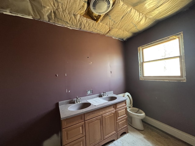 11 Dragonfly Dr, Windham, ME 04062 - bathroom featuring a sink, baseboards, toilet, and double vanity