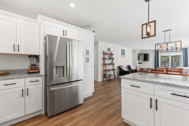 31 Neptune Dr, Brunswick, ME 04011 - kitchen with white cabinets, a chandelier, recessed lighting, wood finished floors, and stainless steel refrigerator with ice dispenser