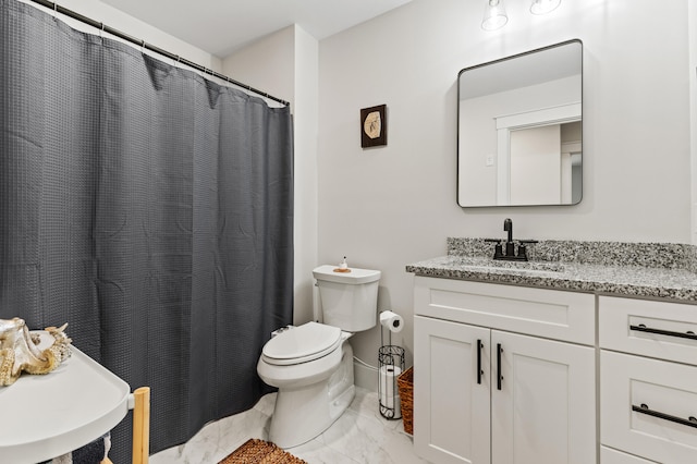 31 Neptune Dr, Brunswick, ME 04011 - bathroom featuring vanity, toilet, and marble finish floor