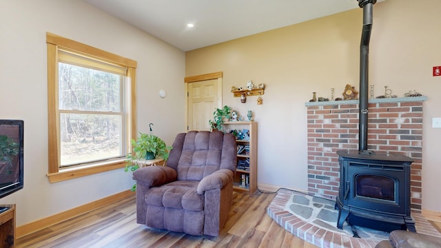 295 Cobb Hill Rd, Otisfield, ME 04270 - sitting room with a wood stove, recessed lighting, and wood finished floors