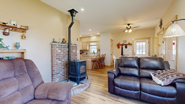 295 Cobb Hill Rd, Otisfield, ME 04270 - living area featuring recessed lighting, a wood stove, a ceiling fan, and light wood finished floors