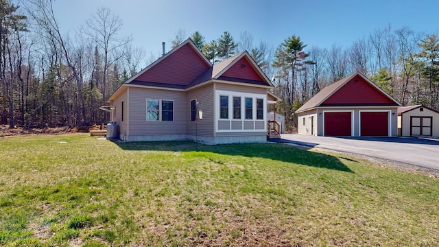 295 Cobb Hill Rd, Otisfield, ME 04270 - view of front of home with an outdoor structure, a front yard, and a detached garage