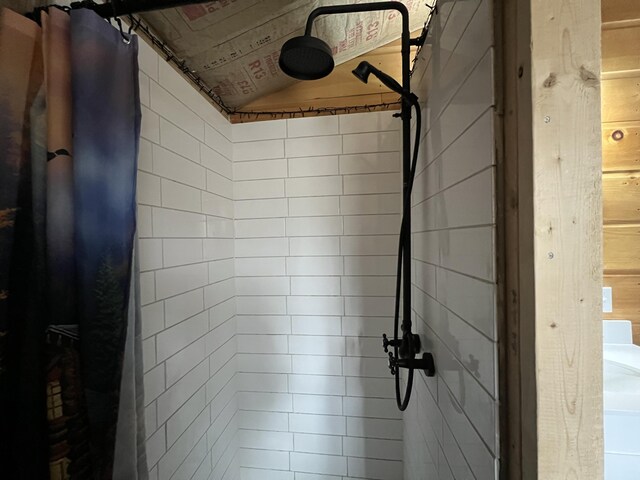 room details with a tile shower