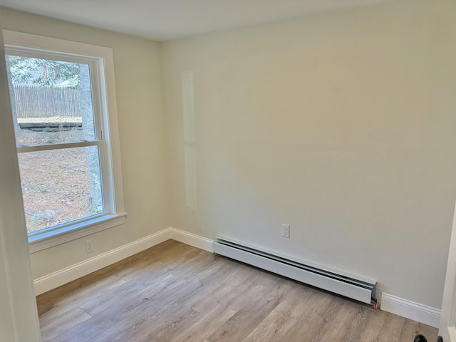 54 Boulder Rd, Raymond, ME 04071 - unfurnished room with baseboard heating and wood finished floors