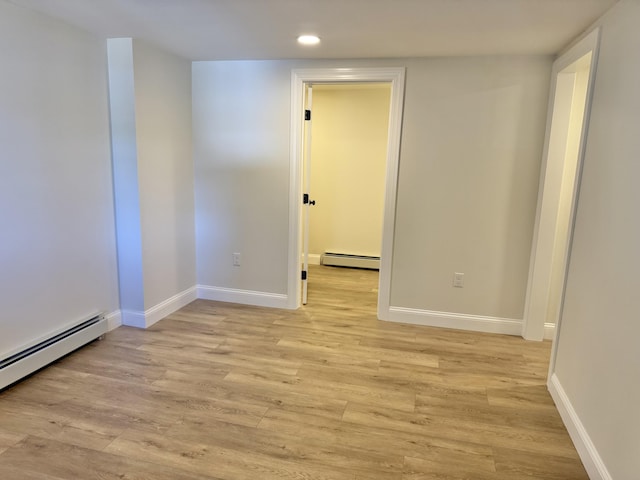 54 Boulder Rd, Raymond, ME 04071 - spare room featuring a baseboard heating unit, recessed lighting, and light wood-type flooring