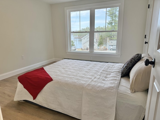 54 Boulder Rd, Raymond, ME 04071 - bedroom featuring wood finished floors and baseboards