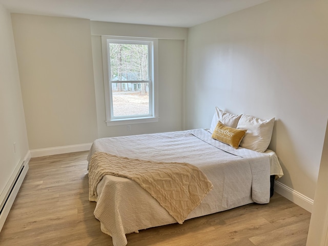 54 Boulder Rd, Raymond, ME 04071 - bedroom featuring baseboard heating and wood finished floors