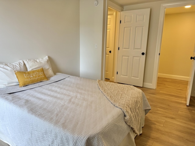 54 Boulder Rd, Raymond, ME 04071 - bedroom with light wood-style flooring and baseboards