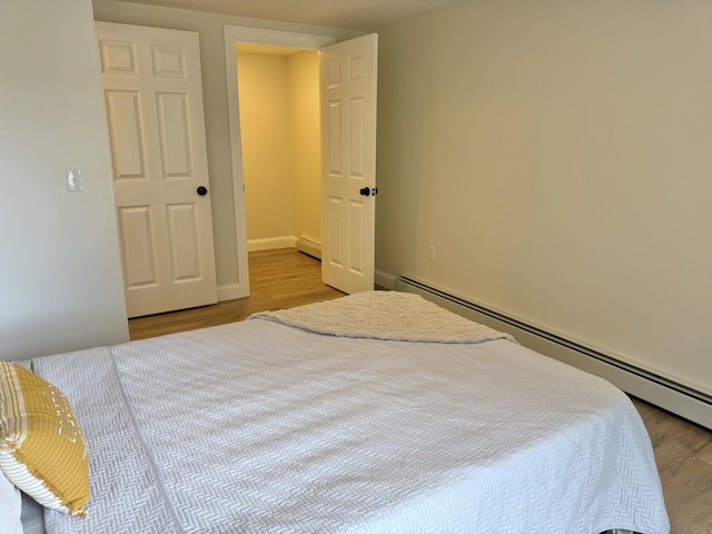 54 Boulder Rd, Raymond, ME 04071 - bedroom with baseboard heating and wood finished floors