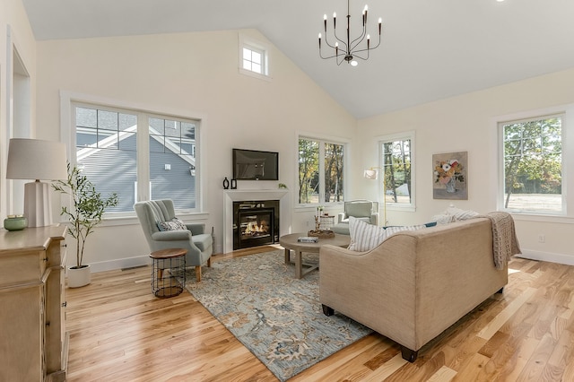 37 Cascade Cir Unit 26, Kennebunk, ME 04043 - living area with light wood-type flooring, a healthy amount of sunlight, and high vaulted ceiling