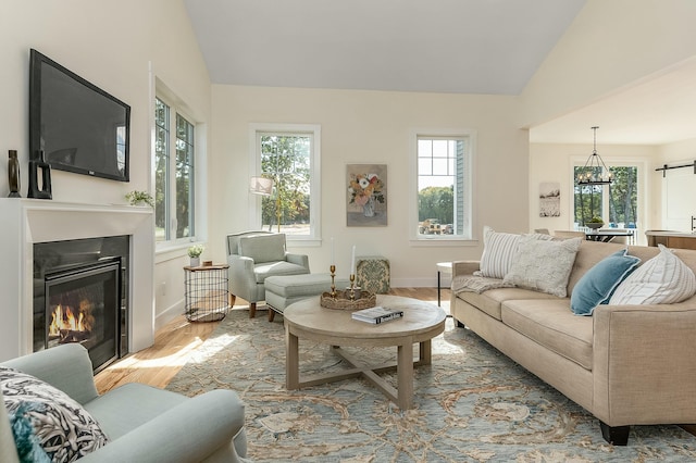 37 Cascade Cir Unit 26, Kennebunk, ME 04043 - living room with lofted ceiling, a wealth of natural light, and wood finished floors